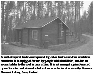 Подпись: A well-designed traditional squared log cabin built to modern insulation standards. It is equipped for use by people with disabilities, and has an access ladder to the roof in case of fire. It is set amongst a pine forest of open character and stained a dull colour in order to fit in visually. Ruunaa National Hiking Area, Finland. 